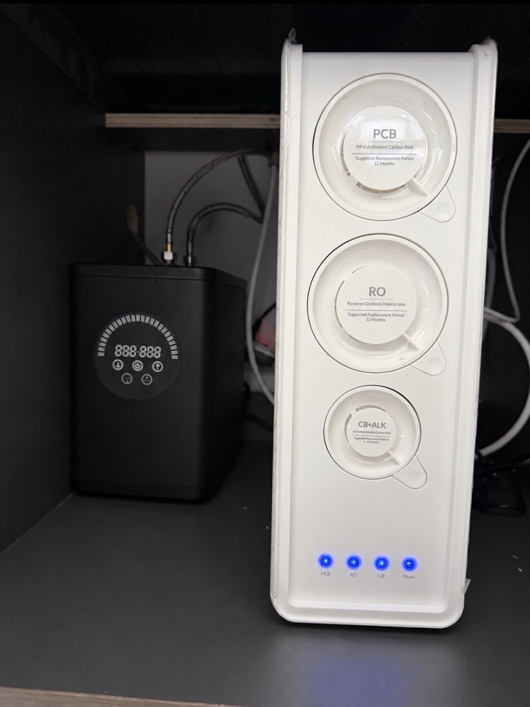 HW800 tankless reverse osmosis system installed under a kitchen sink by Airgead