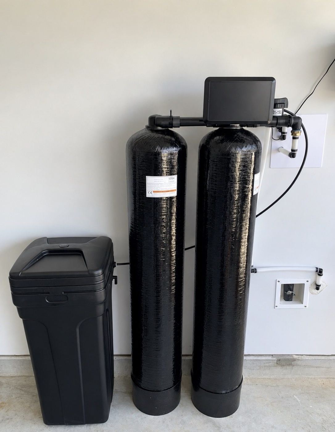 Dual-tank city water system with a full resin tank, full carbon tank, and brine tank